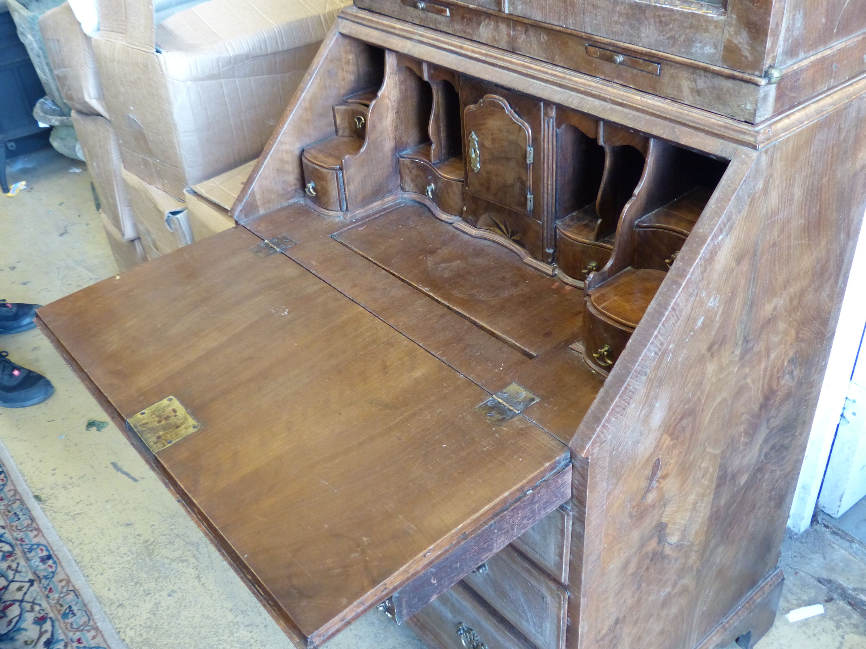 A Queen Anne style walnut double domed top bureau bookcase, length 72cm, width 50cm, height 196cm